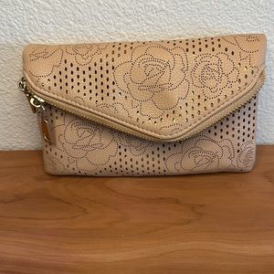 URBAN EXPRESSIONS Crossbody or wristlet. Beige with rose cutout pattern. Used